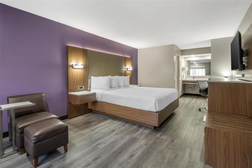 a hotel room with a bed and a bathroom at Best Western Airport Plaza Inn Hotel - Los Angeles LAX in Los Angeles