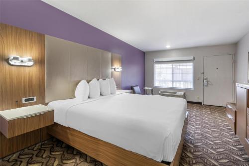 a large white bed in a hotel room at Best Western Airport Plaza Inn Hotel - Los Angeles LAX in Los Angeles