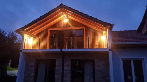 a house with lights on the top of it at Eco Charm Discovery Quinta da Oliveirinha in Helenos