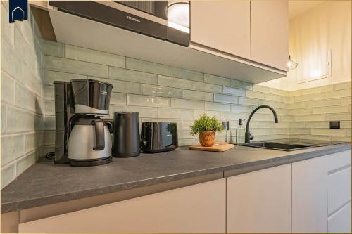 a kitchen with a coffee maker on a counter at FeWo 11 "Seelenwind" in Benz