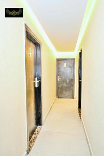 an empty corridor with a door and a hallway at Comfort in Cairo