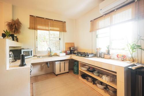 a kitchen with a sink and a counter top at Sunset beach villa 7 O3 villas in Haad Pleayleam