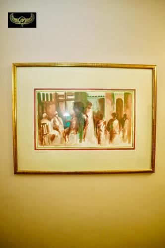 a framed picture of a group of people at Comfort in Cairo
