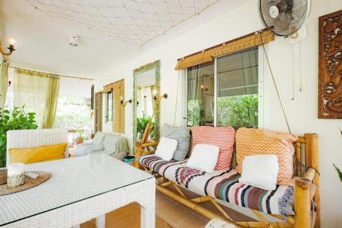 a living room with a couch and a table at Sunset beach villa 7 O3 villas in Haad Pleayleam