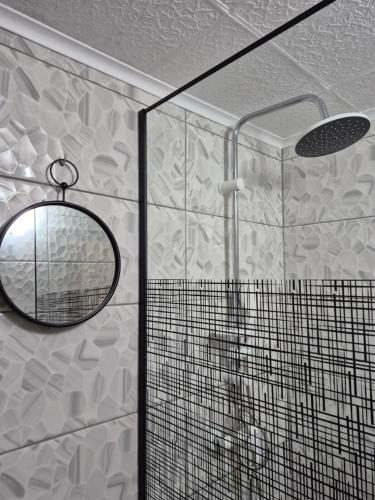 a bathroom with a mirror and a shower at Holiday Home CASTLE in Bihać