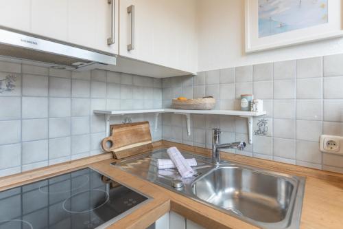 a kitchen with a sink and a counter top at Wellenklang in Böhl