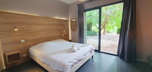 Ένα ή περισσότερα κρεβάτια σε δωμάτιο στο Superbe villa duplex - Piscine - 6 adultes 4 enfants