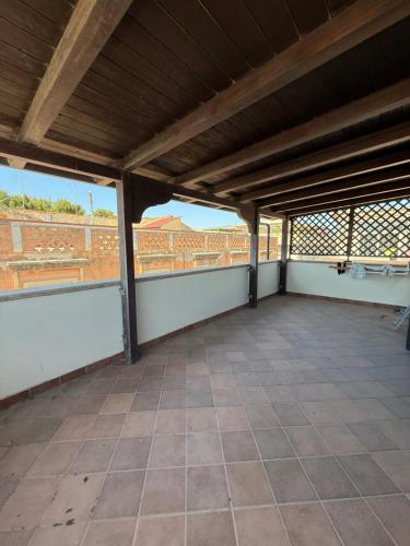an empty room with a view of a building at Cadorna36 in Locri