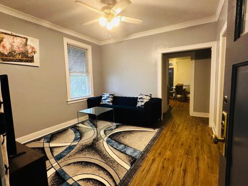 a living room with a couch and a table at Cozy in Hyde Park Greater Grand Crossing in Chicago