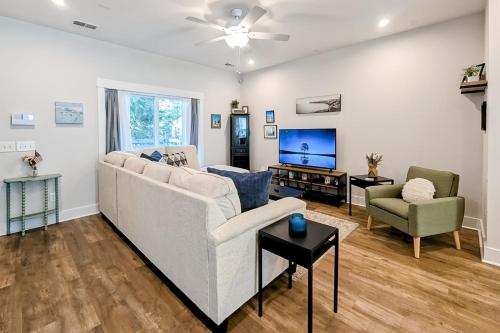 a living room with a couch and a tv at 4563 Summey Street in Charleston