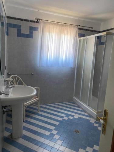 a bathroom with a shower and a white sink at Pompei Ruins in Torre Annunziata