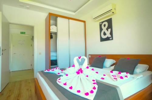 Кровать или кровати в номере Sweet Home Kemer Apartments