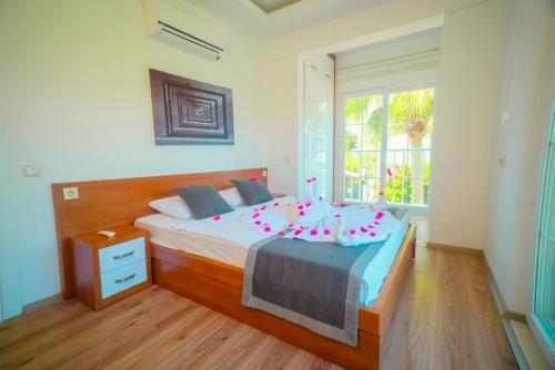 Кровать или кровати в номере Sweet Home Kemer Apartments