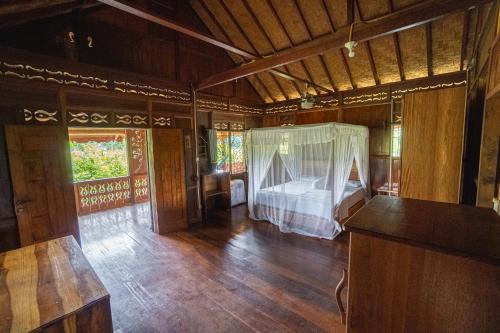 Katil atau katil-katil dalam bilik di Sawah Indah View Guesthouse