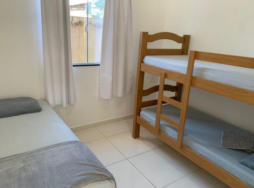 Postel nebo postele na pokoji v ubytování Casa no Litoral em Matinhos