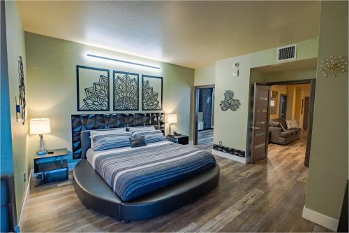a bedroom with a large bed in a room at 2100 SqFt Penthouse Suite W/ Strip Views! POOL GYM in Las Vegas