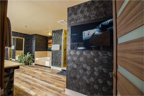 a bathroom with a blow dryer on the wall at 2100 SqFt Penthouse Suite W/ Strip Views! POOL GYM in Las Vegas