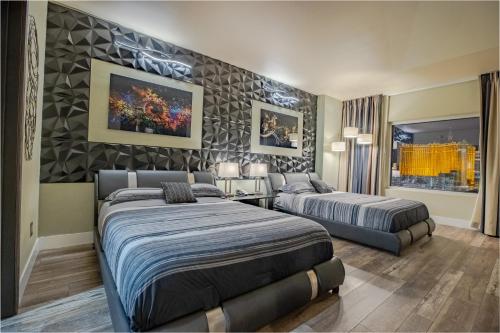 a hotel room with two beds at 2100 SqFt Penthouse Suite W/ Strip Views! POOL GYM in Las Vegas