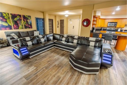 a living room with a couch and a table at 2100 SqFt Penthouse Suite W/ Strip Views! POOL GYM in Las Vegas