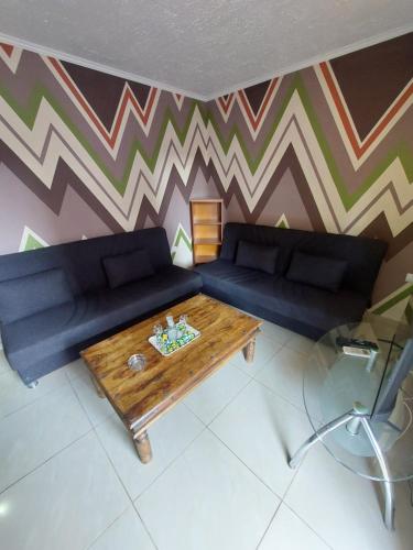 a living room with a couch and a coffee table at The Mastiha Spot 3 in Chios
