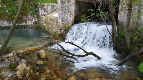 a waterfall in the middle of a creek at Amelia Sweet Home - Farindola in Farindola