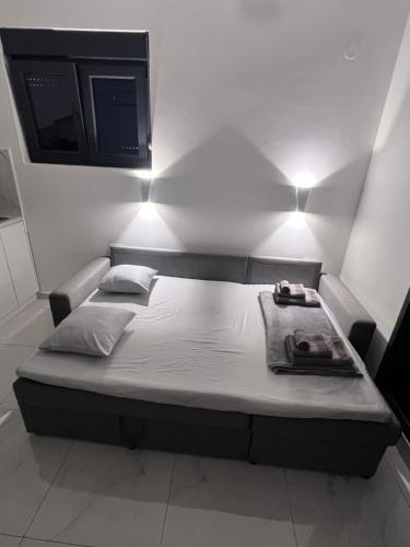 Ένα ή περισσότερα κρεβάτια σε δωμάτιο στο Blue Haven apartments