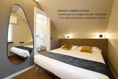 Katil atau katil-katil dalam bilik di Albergo Moderno & Spa