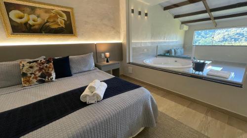 Ένα ή περισσότερα κρεβάτια σε δωμάτιο στο Pousada Santa Fe de Penedo