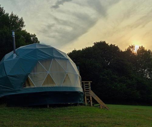 a tent in the middle of a field at GLAMPING Považie in Trenčín