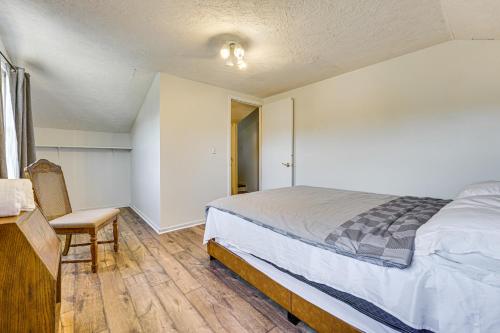 a bedroom with a bed and a chair in it at Private Pool and Yard Pet-Friendly Home in Toledo in Toledo