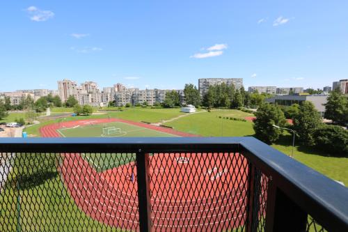 a view of a baseball field from a balcony at Flat for 2 or 1 with Free Parking and Fast Wi-Fi in Vilnius