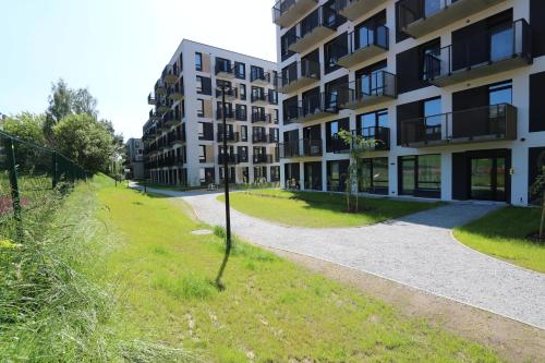 an empty street in front of an apartment building at Flat for 2 or 1 with Free Parking and Fast Wi-Fi in Vilnius