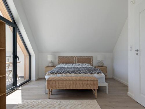a bedroom with a bed and a large window at Odpoczynek na wsi 