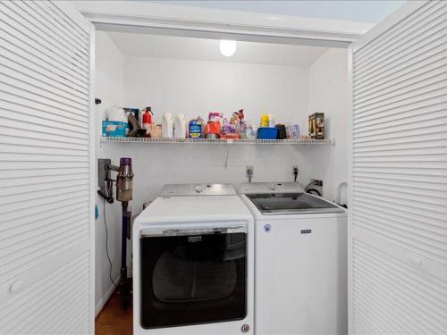 a small kitchen with a sink and a stove at Seabreeze village 5 in Dewey Beach
