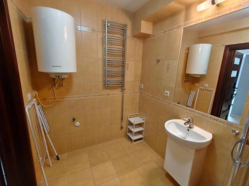 a bathroom with a toilet and a sink and a mirror at apartamenty sarbinowo in Sarbinowo