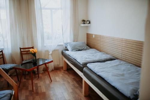 Postel nebo postele na pokoji v ubytování Dráchovský dvorek