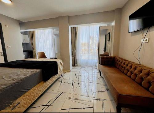 a hotel room with a bed and a couch at Otantik Taksim Hotel in Istanbul