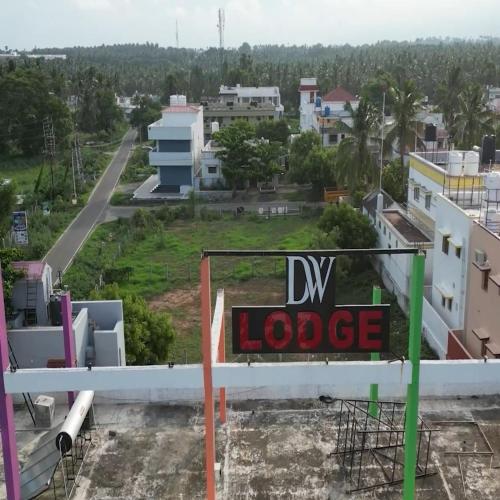 a sign on the side of a building at Deepwoods Stay-Kinathukadavu, Coimbatore in Coimbatore