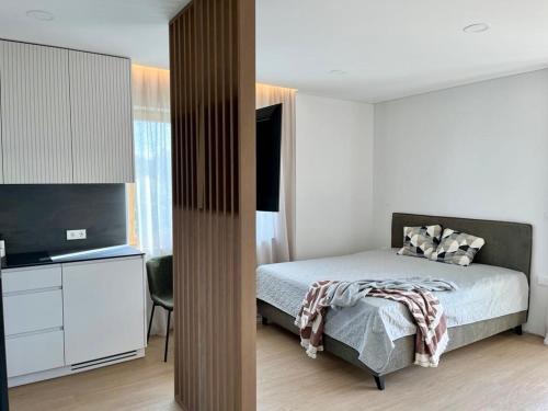 Kama o mga kama sa kuwarto sa Apartaments Jūratės 25
