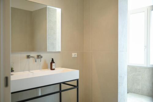 a bathroom with a white sink and a mirror at Studio Venice Mestre Centrale in Venice