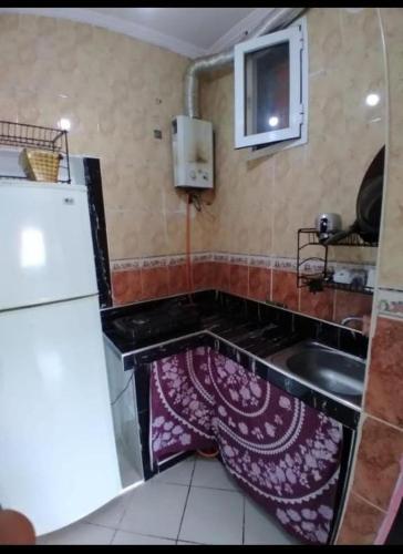 a small kitchen with a sink and a sink at complexe MIXTA SAFIA BLOCK 7 ETG 2 APRT 40 MARTIL in Martil