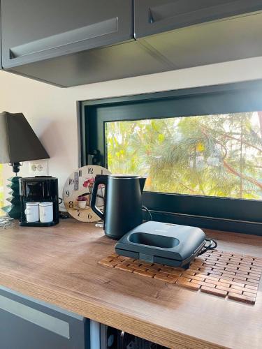 a toaster sitting on top of a kitchen counter at Villa Ela - Cape of Rodon in Draçi