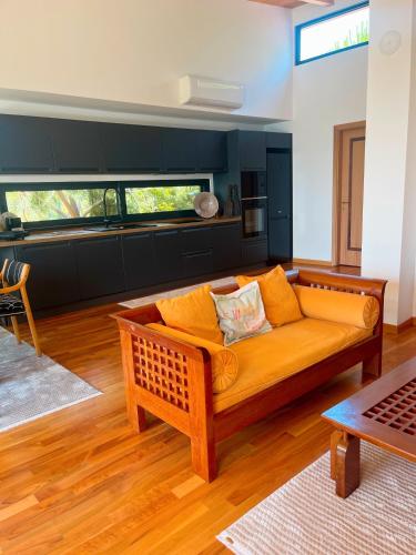 a living room with a couch and a table at Villa Ela - Cape of Rodon in Draçi