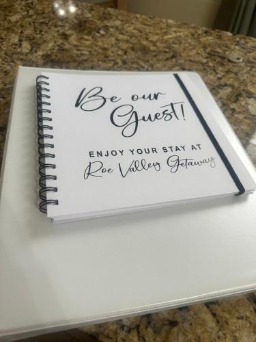 a notebook sitting on top of a table at Roe Valley Getaway in Limavady