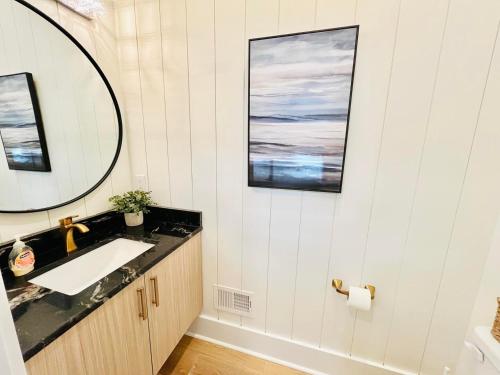 a bathroom with a sink and a mirror at Columbia avenue 48 in Rehoboth Beach