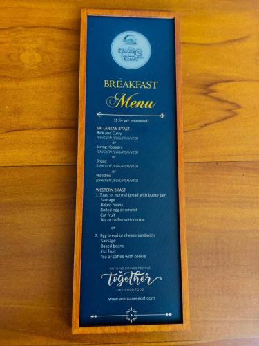 Et logo, certifikat, skilt eller en pris der bliver vist frem på Ambula Resort