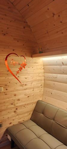 a room with a sauna with a heart on the wall at GioiaVitae - Bed-in-Botte - Dormire in vigna in Luogosano