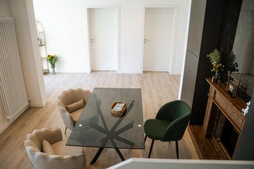 a living room with a glass table and chairs at Studio Venice Mestre Centrale in Venice