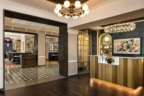 a lobby of a hotel with a chandelier at The Talbott, Autograph Collection in Chicago