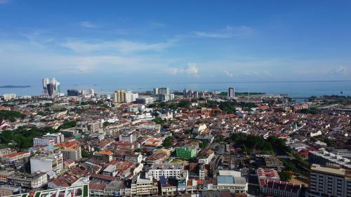 an aerial view of a city with buildings and the ocean at The Shore Hotel & Residences in Melaka